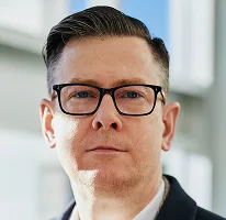 暗号資産取引会社のCEO兼役員、Alexander Hughesのポートレート